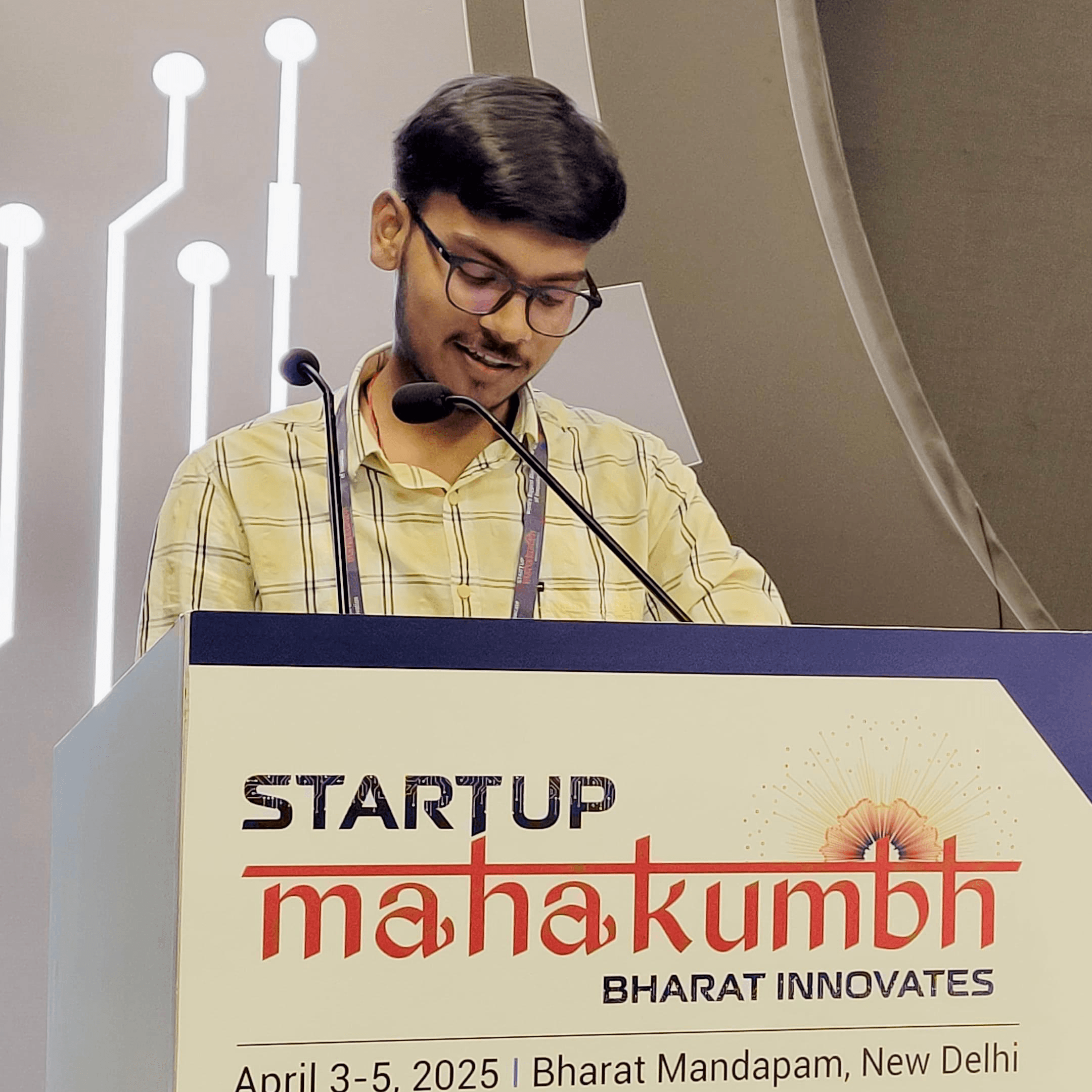 Speaking on stage at for a hackathon presentation